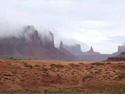 WS PAN View of fog coming off of monument valley / Monument Valley, Utah, United States  Stock Footage