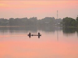 Fishermen at dawn long focus shot. Stock Footage