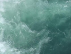 MS AERIAL Shot of flowing water at Godafoss waterfall / Iceland Stock Footage