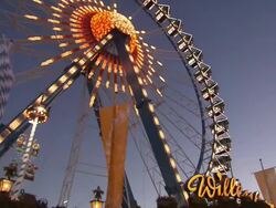 ferris wheel at night and flashing lights Stock Footage