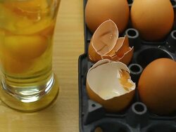 Eggs in glass and stir Stock Footage