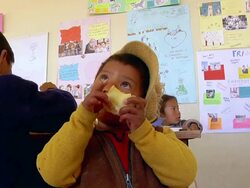 MS Shot of kid eating lunch at School in Potosi Mountains / Potosi, Bolivia Stock Footage