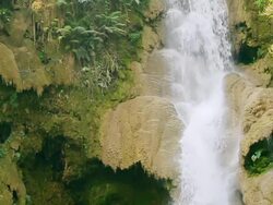 MS SLO MO Shot of water falling over brown unusual rocks / Kuang Si, Luang Prabang, Laos Stock Footage