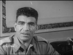 1952: CAIRO, EGYPT: WS General Muhammad Naguib (1901-1984) sitting at desk in Prime Minister's office w/ unidentified aide, MS General Naguib SOT saying no political ambitions, anxious to restore democratic government, rid corruption, justice for all. Instructional Video