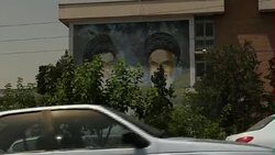 Driving Shot Past Ayatollah Khomeini Mural News Clip