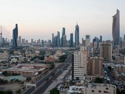 Arabian Peninsula, Kuwait, Kuwait City, Elevated day to night transition over the city centre Stock Footage