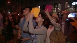ATMOSPHERE - spectators and signage at Projecting Change: The Empire State Building Stock Footage