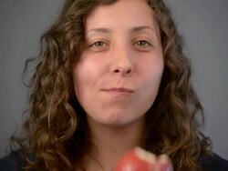 Young woman eat red apple. Stock Footage