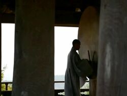 MS PAN Shot of Buddhist monk strking hugh drum in Buseoksa Temple / Yeongju, Gyeongsangbuk-do, South Korea Stock Footage
