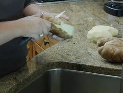 Slicing potatoes Stock Footage