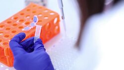 Scientist transfer mix small volume liquids within 96 well dishes, Slow motion Stock Footage