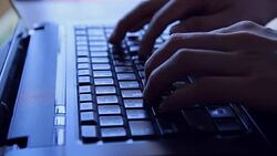 man hand typing on laptop computer keyboard Stock Footage