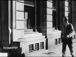 1949: NEW YORK CITY: MS 'New York Public Library Carnegie Gift 58th Street Branch' plaque on building, young male teen student walking into building. Instructional Video