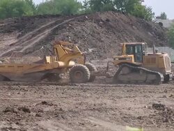Heavy machinery working at a constructions site Stock Footage