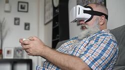 adult senior man and a virtual reality headset. graybearded man using vr glasses Stock Footage
