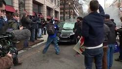 Limousine being torched by protesters News Clip