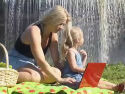 Mother and Daughter by Waterfall Stock Footage