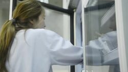 Asia medical technician woman doing quality control of blood bag during storage refrigerator in laboratory hospital Stock Footage