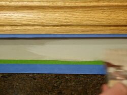 Gloved Hand Staining Oak Window Trim Stock Footage