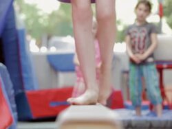  CU Child's feet walking on balance beam / Vancouver, British Columbia, Canada Stock Footage