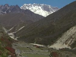 Tilt from Mount Everest to a valley below. Stock Footage