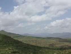 Green landscape with moving clouds Stock Footage