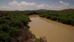 Fly low over Rio Grande River from Big Bend National Park Texas looking at Mexico Stock Footage