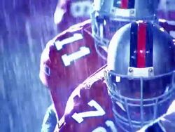 OVEREXPOSED close up ball snapped into play, quarterback passes to player who runs through tackles / rain Stock Footage