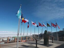 Bust of Admiral Byrd and flags, McMurdo Base, Antarctica  Stock Footage