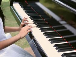 Girl playing a piano  Stock Footage