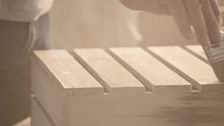 Carpenter painting wooden furniture Stock Footage