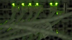 Zoom in UTP cables, blinking LED lights and RJ 45 on working Ethernet switches Stock Footage