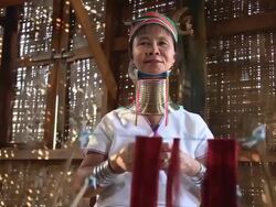 MS LA Shot of Elderly woman wearing neck rings weaving on loom / Inle Lake, Shan State, Myanmar   Stock Footage