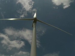 MS Shot of wind turbine blades rotating with clouds moving slowly across sky / Buffalo, Oklahoma, United States Stock Footage