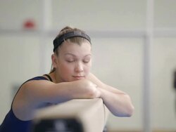  MS Gymnast resting chin on balance beam / Vancouver, British Columbia, Canada Stock Footage