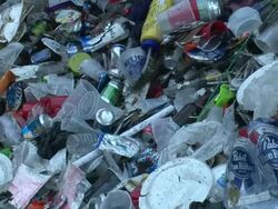 Medium Close Up - Trash pile being pushed by garbage truck / New Orleans Louisiana Stock Footage