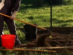 HD: Raking the soil Stock Footage