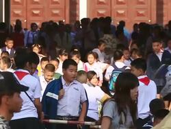 MS SLO MO School childrenwalking out after  school hours / Vientiane, Laos  Stock Footage