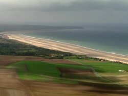AERIAL foggy beach and farmland/ Pas-de-Calais, France Stock Footage