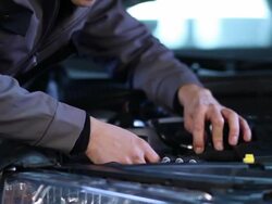 Mechanic Replaceing Headlight Bulb Stock Footage