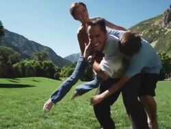 father playing football with his kids Stock Footage
