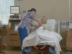 Female nurse checking and talking to a pregnant woman Stock Footage