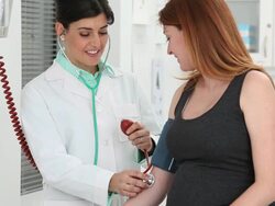 MS Doctor Checking Blood Pressure of Pregnant Woman / Richmond, Virginia, USA Stock Footage
