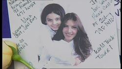 Mourners and missing posters on wall News Clip