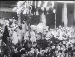 Gandhi Greeted by Hysterical Crowd News Clip