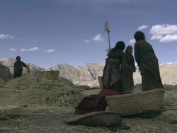 WS PAN Nomad tying prayer flags / Himalayas, Upper Dolpo, Nepal  Stock Footage