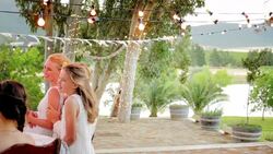 Father of the bride pouring champagne for guests at wedding reception Stock Footage