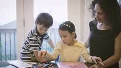 Mother helping children with homework Stock Footage