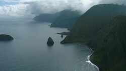 Aerial view of mountainous coastline and small islands off the coast of Molokai, Hawaii. Stock Footage