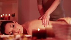 Beautiful woman enjoying massage treatment Stock Footage